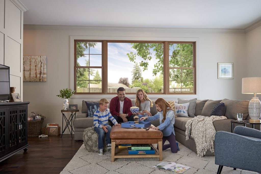 Family sitting on a couch playing a game
