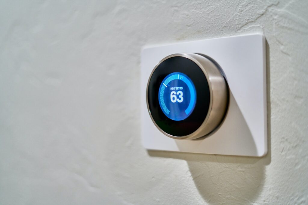 digital thermostat on home wall